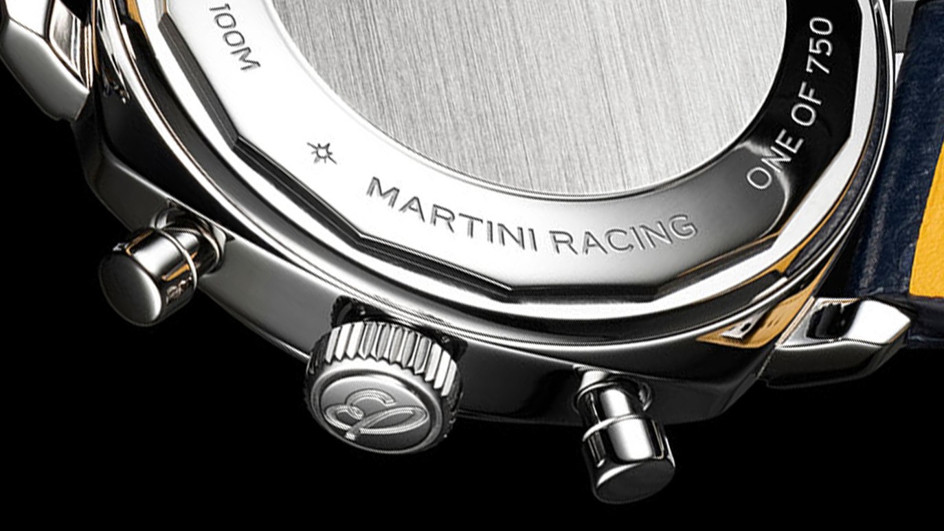 {generated} Close-up of the Breitling Top Time Racing Grid Martini caseback showing engraved details and polished steel finish.